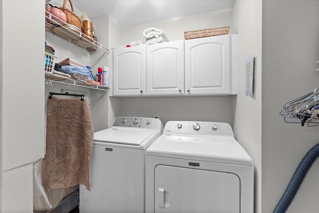 8719 Glenaire Dr, Chattanooga, TN 37416 - laundry room with washing machine and dryer, cabinet space, and a textured ceiling