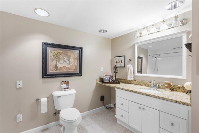 8719 Glenaire Dr, Chattanooga, TN 37416 - bathroom with vanity, baseboards, toilet, tile patterned flooring, and a shower