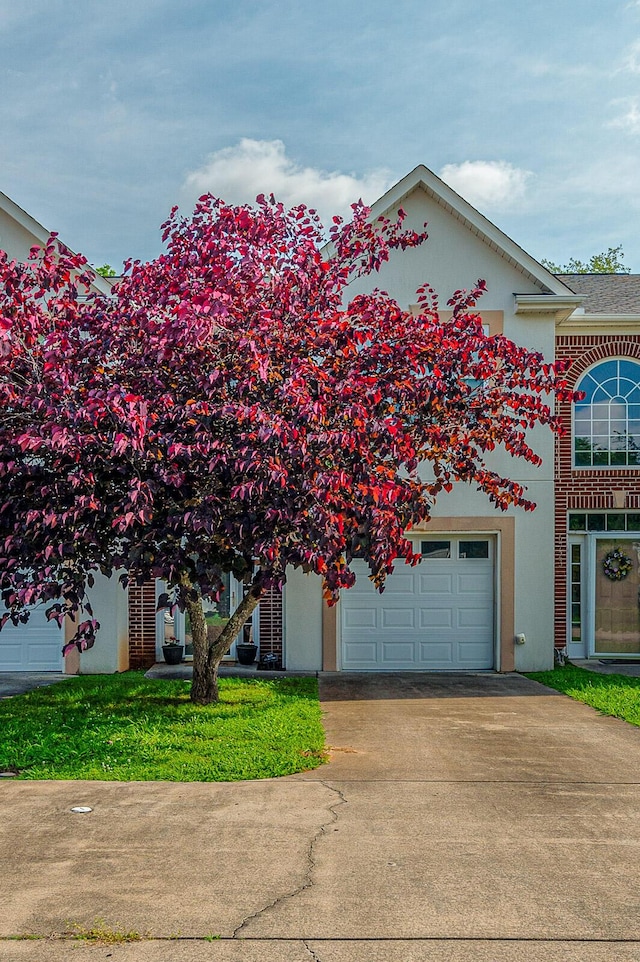 6721 Brianna Way, Chattanooga, TN 37421 - view of front facade with driveway and stucco siding