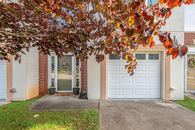 6721 Brianna Way, Chattanooga, TN 37421 - entrance to property featuring driveway, stucco siding, and a garage