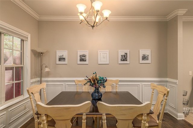 6721 Brianna Way, Chattanooga, TN 37421 - dining room featuring crown molding, a chandelier, a wainscoted wall, a decorative wall, and dark wood-type flooring