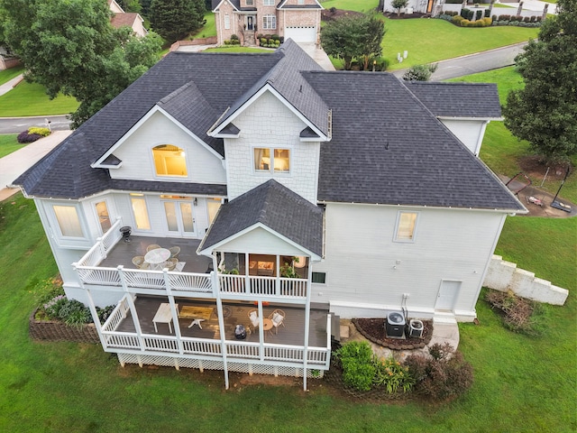 649 Wisley Way, Ringgold, GA 30736 - rear view of house featuring a shingled roof, a deck, and a lawn