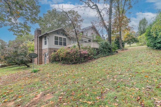 7127 Revere Cir, Chattanooga, TN 37421 - view of property exterior featuring a chimney, a yard, and brick siding