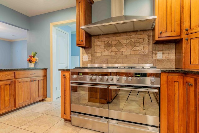 7127 Revere Cir, Chattanooga, TN 37421 - kitchen featuring wall chimney exhaust hood, double oven range, backsplash, brown cabinets, and crown molding