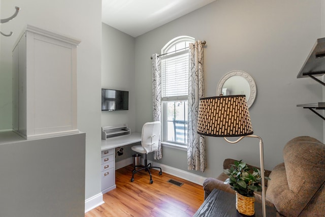 9923 Sims Harris Rd, Ooltewah, TN 37363 - office featuring light wood finished floors, built in desk, and baseboards