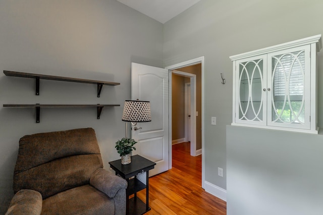 9923 Sims Harris Rd, Ooltewah, TN 37363 - living area with wood finished floors, baseboards, and a high ceiling