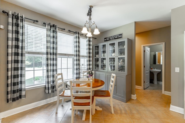 9923 Sims Harris Rd, Ooltewah, TN 37363 - dining room featuring light tile patterned flooring, baseboards, and a chandelier