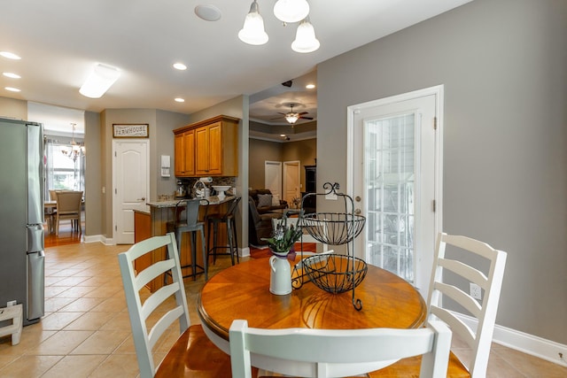 9923 Sims Harris Rd, Ooltewah, TN 37363 - dining space with light tile patterned floors, a chandelier, baseboards, ceiling fan, and recessed lighting