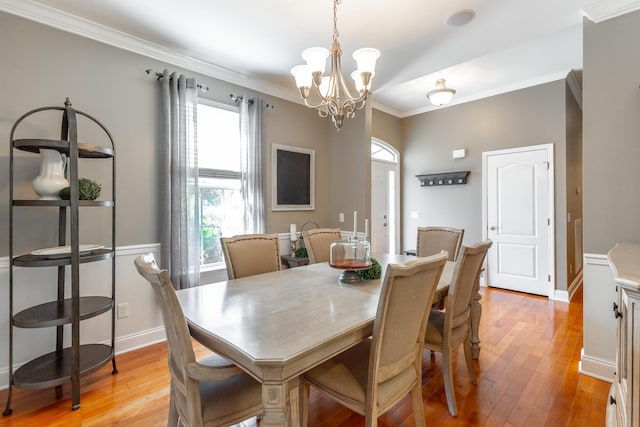 9923 Sims Harris Rd, Ooltewah, TN 37363 - dining room featuring a chandelier, light wood finished floors, crown molding, and baseboards