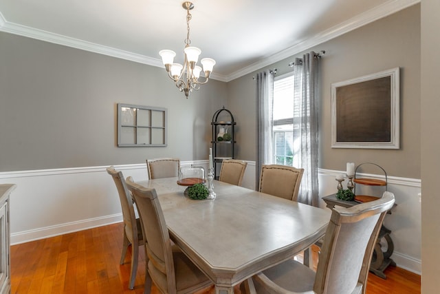 9923 Sims Harris Rd, Ooltewah, TN 37363 - dining room featuring a chandelier, ornamental molding, hardwood / wood-style flooring, and baseboards
