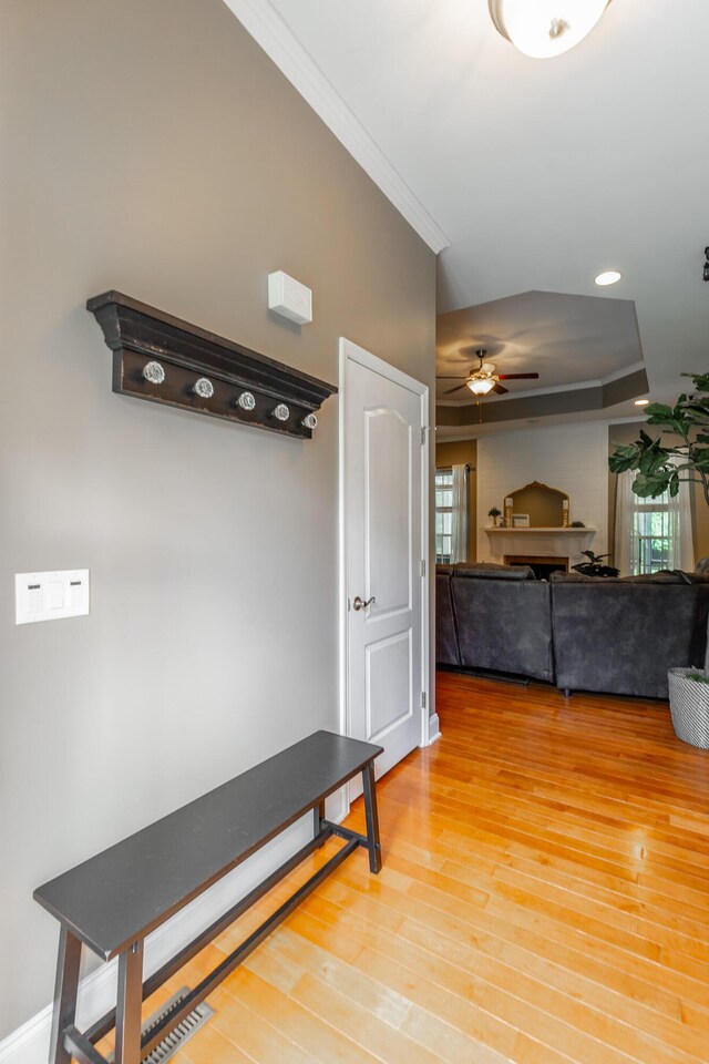 9923 Sims Harris Rd, Ooltewah, TN 37363 - mudroom featuring ornamental molding, ceiling fan, light wood-style flooring, a tray ceiling, and baseboards