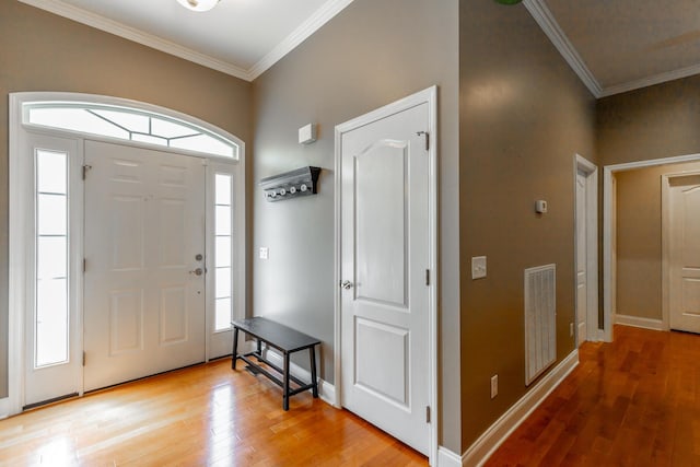 9923 Sims Harris Rd, Ooltewah, TN 37363 - foyer entrance featuring light wood-type flooring, crown molding, and baseboards