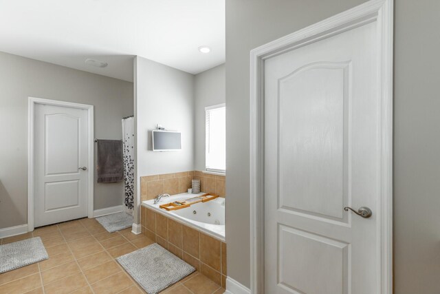 9923 Sims Harris Rd, Ooltewah, TN 37363 - bathroom with a jetted tub, tile patterned floors, baseboards, and curtained shower