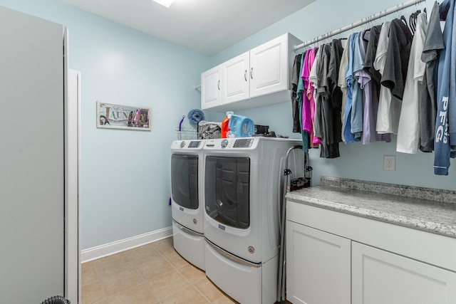 9923 Sims Harris Rd, Ooltewah, TN 37363 - washroom with cabinet space, independent washer and dryer, baseboards, and light tile patterned floors