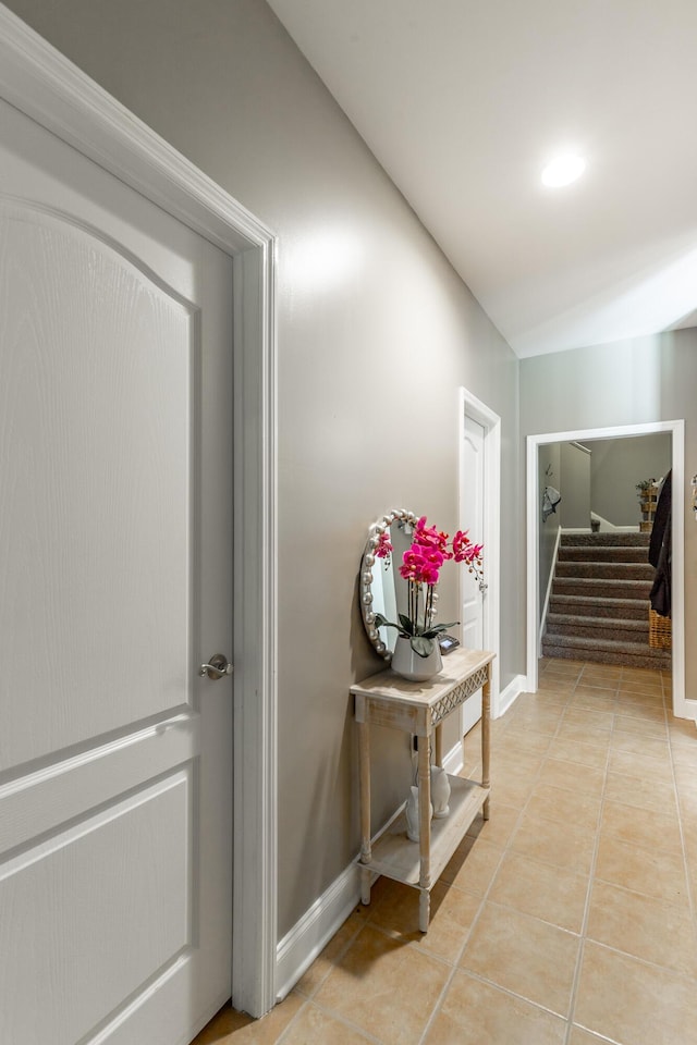 9923 Sims Harris Rd, Ooltewah, TN 37363 - hallway featuring light tile patterned floors, stairs, and baseboards