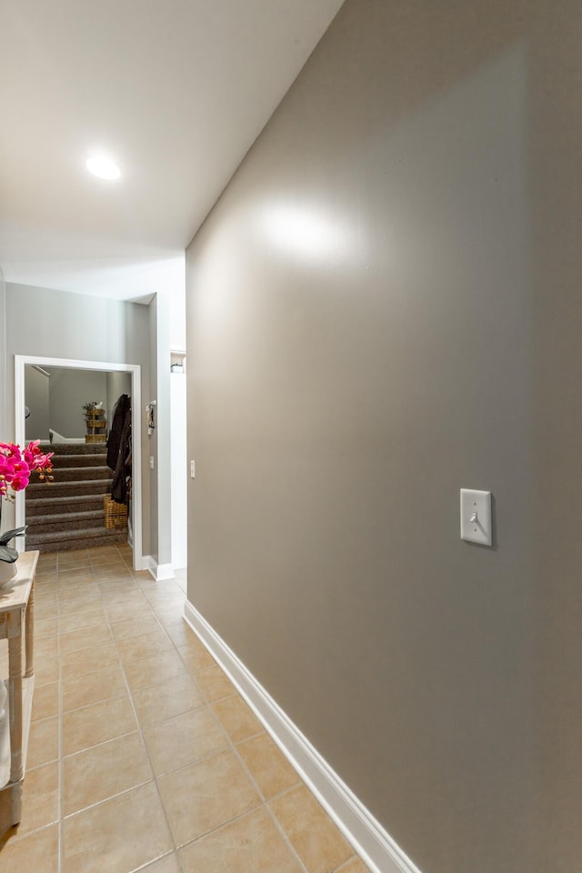 9923 Sims Harris Rd, Ooltewah, TN 37363 - corridor featuring stairway, light tile patterned floors, and baseboards