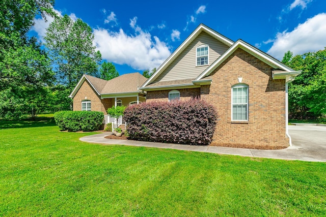 9923 Sims Harris Rd, Ooltewah, TN 37363 - traditional home featuring brick siding and a front lawn