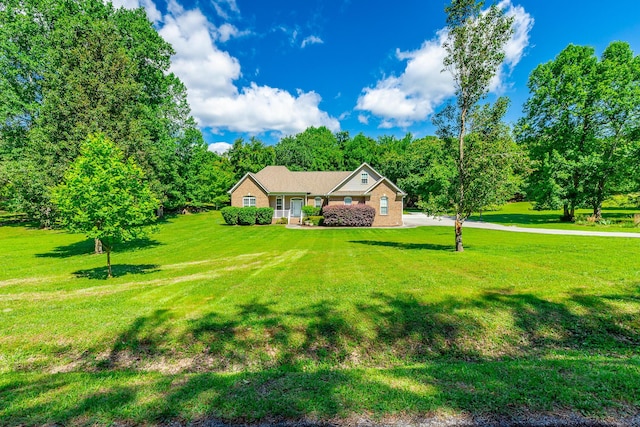 9923 Sims Harris Rd, Ooltewah, TN 37363 - view of front of house with a front lawn