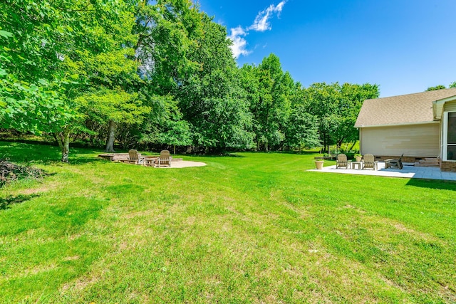 9923 Sims Harris Rd, Ooltewah, TN 37363 - view of green lawn with a fire pit and a patio