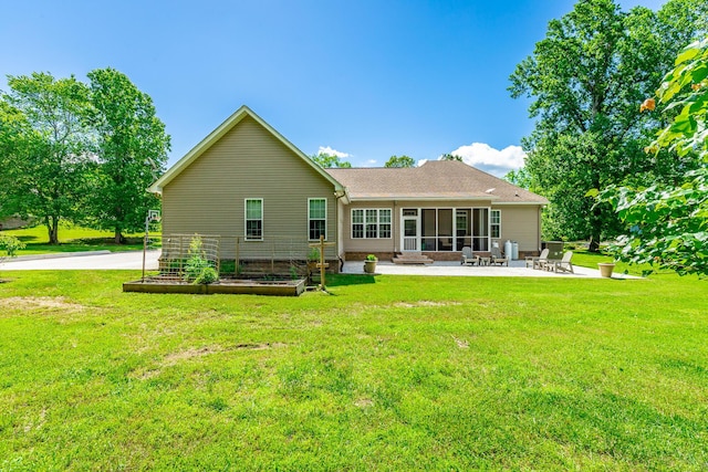 9923 Sims Harris Rd, Ooltewah, TN 37363 - back of property with a patio area, a sunroom, a vegetable garden, and a yard