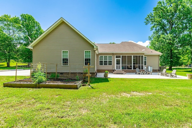9923 Sims Harris Rd, Ooltewah, TN 37363 - rear view of house with a vegetable garden, a patio area, a sunroom, a yard, and a shingled roof