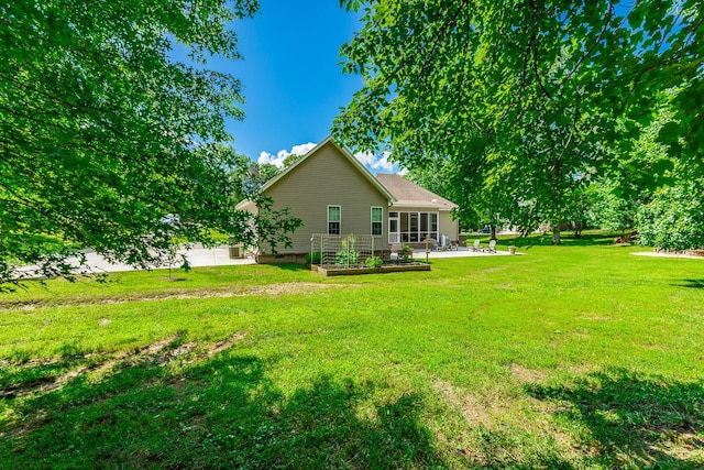9923 Sims Harris Rd, Ooltewah, TN 37363 - view of grassy yard featuring a patio and a garden