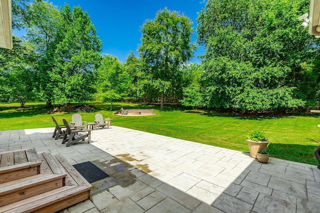 9923 Sims Harris Rd, Ooltewah, TN 37363 - view of patio with an outdoor fire pit and view of wooded area