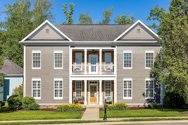 2027 Holden Farm Pl Unit 622, Ooltewah, TN 37363 - view of front of house featuring a balcony, a porch, a shingled roof, and a front lawn