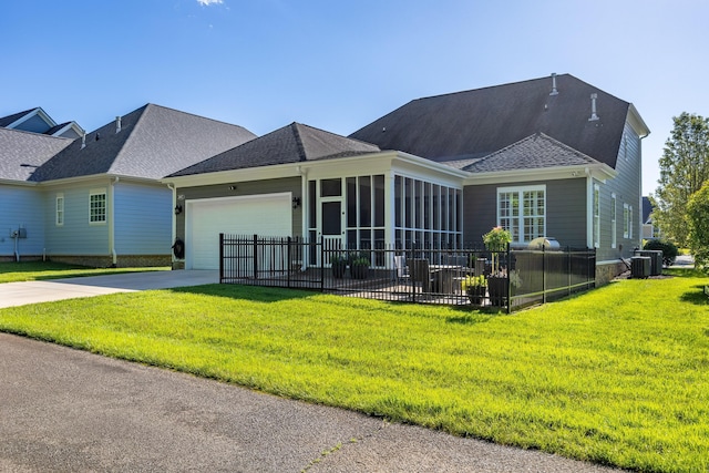 2027 Holden Farm Pl Unit 622, Ooltewah, TN 37363 - view of front of house featuring concrete driveway, an attached garage, central air condition unit, a shingled roof, and a sunroom