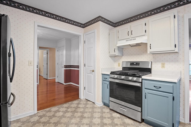 20 Debbie Ln, Ringgold, GA 30736 - kitchen with appliances with stainless steel finishes, under cabinet range hood, crown molding, wallpapered walls, and light floors