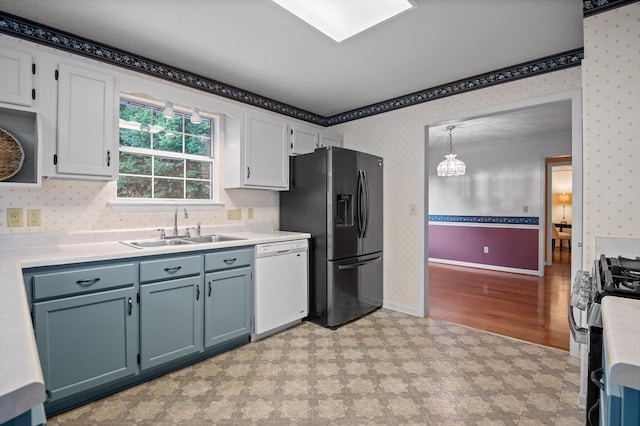 20 Debbie Ln, Ringgold, GA 30736 - kitchen with appliances with stainless steel finishes, wallpapered walls, a chandelier, light floors, and light countertops