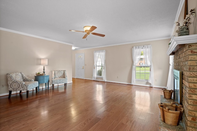 20 Debbie Ln, Ringgold, GA 30736 - living area featuring a ceiling fan, a fireplace, wood finished floors, and crown molding