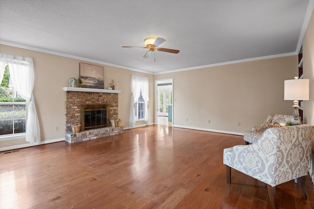 20 Debbie Ln, Ringgold, GA 30736 - living room with ceiling fan, wood finished floors, a fireplace, and crown molding
