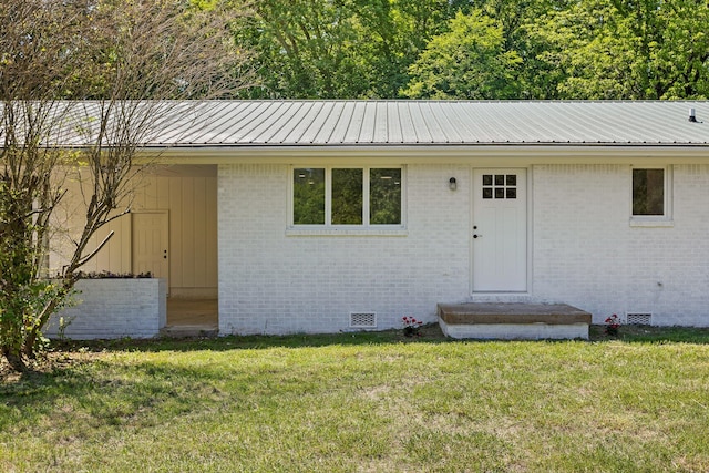 1795 Dowdy Rd, Cleveland, TN 37323 - view of front of home featuring crawl space, a front yard, metal roof, and brick siding