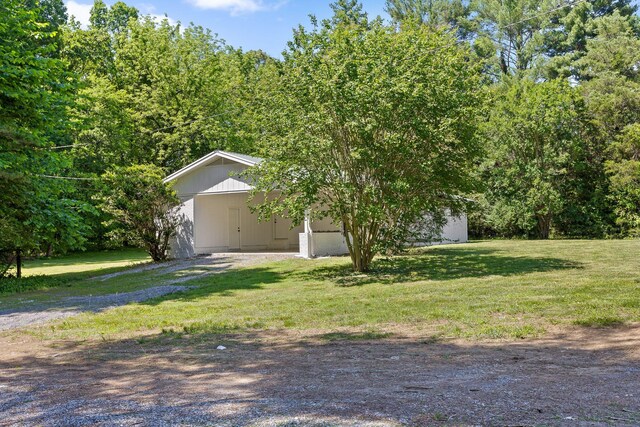 1795 Dowdy Rd, Cleveland, TN 37323 - obstructed view of property featuring a front lawn, driveway, and a carport