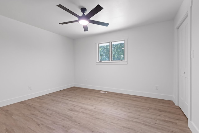 1795 Dowdy Rd, Cleveland, TN 37323 - unfurnished bedroom featuring light wood-type flooring, baseboards, a closet, and a ceiling fan