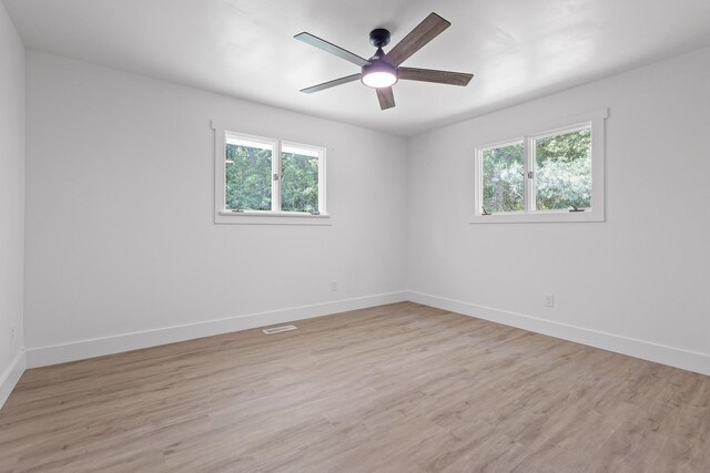 1795 Dowdy Rd, Cleveland, TN 37323 - empty room with plenty of natural light, light wood-type flooring, and baseboards
