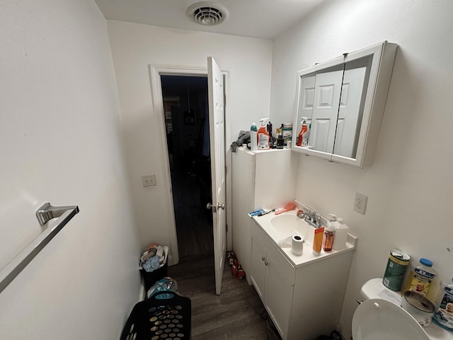 155 Red Rd, Chatsworth, GA 30705 - bathroom with wood finished floors, vanity, and toilet