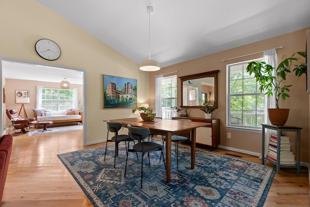 5726 Browntown Rd, Chattanooga, TN 37415 - dining area with healthy amount of natural light, wood finished floors, vaulted ceiling, and baseboards