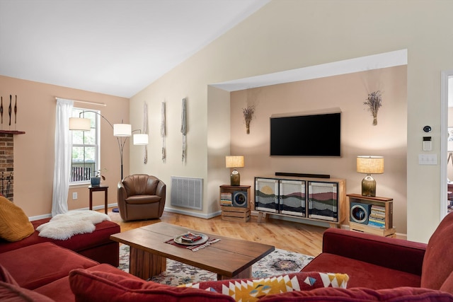 5726 Browntown Rd, Chattanooga, TN 37415 - living room with vaulted ceiling, wood finished floors, baseboards, and a fireplace