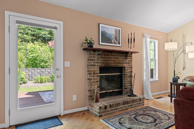 5726 Browntown Rd, Chattanooga, TN 37415 - living room with light wood-type flooring, baseboards, and a fireplace