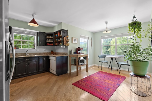 5726 Browntown Rd, Chattanooga, TN 37415 - kitchen with stainless steel fridge with ice dispenser, light wood-style flooring, light stone countertops, a sink, and dishwashing machine