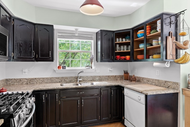 5726 Browntown Rd, Chattanooga, TN 37415 - kitchen featuring a sink, dishwasher, light stone counters, stainless steel range with gas cooktop, and open shelves
