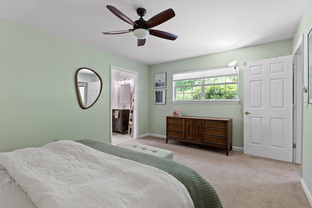 5726 Browntown Rd, Chattanooga, TN 37415 - carpeted bedroom featuring baseboards, ceiling fan, and connected bathroom