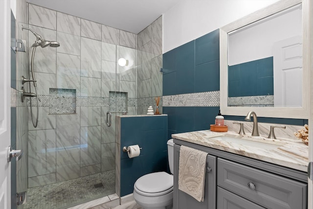 5726 Browntown Rd, Chattanooga, TN 37415 - bathroom with vanity, a stall shower, toilet, and tile walls