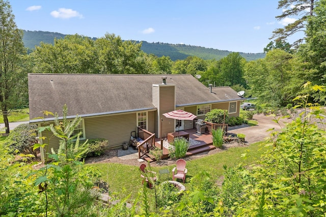 5726 Browntown Rd, Chattanooga, TN 37415 - back of house with a deck, a chimney, and a wooded view