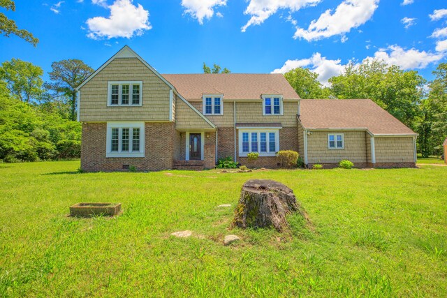 7900 Ooltewah Georgetown Rd, Ooltewah, TN 37363 - view of front of property with a front yard, brick siding, and a fire pit