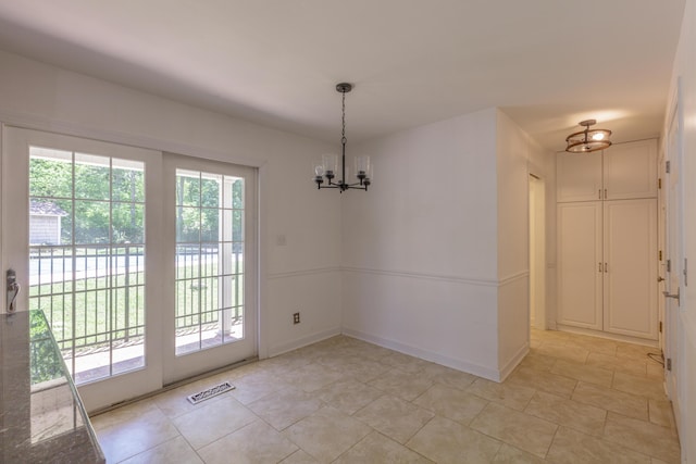 7900 Ooltewah Georgetown Rd, Ooltewah, TN 37363 - unfurnished dining area featuring plenty of natural light, a chandelier, and light tile patterned floors