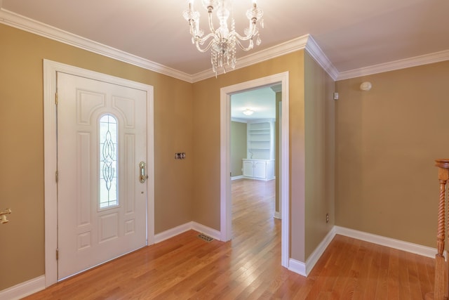 7900 Ooltewah Georgetown Rd, Ooltewah, TN 37363 - foyer entrance with a chandelier, light wood finished floors, crown molding, and baseboards