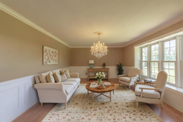7900 Ooltewah Georgetown Rd, Ooltewah, TN 37363 - living room with light wood finished floors, a chandelier, crown molding, a decorative wall, and wainscoting